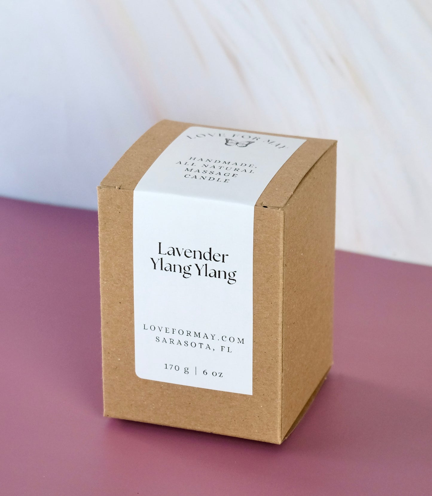 A box for a lavender ylang ylang body oil candle