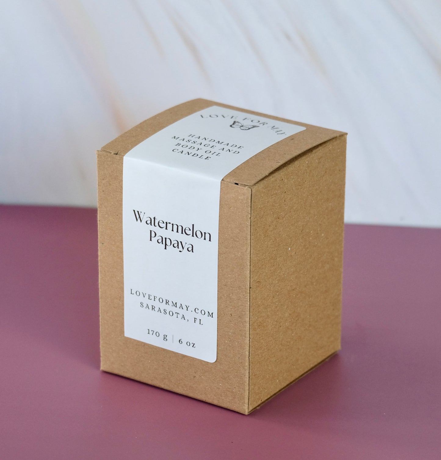 A labeled box for a watermelon massage candle
