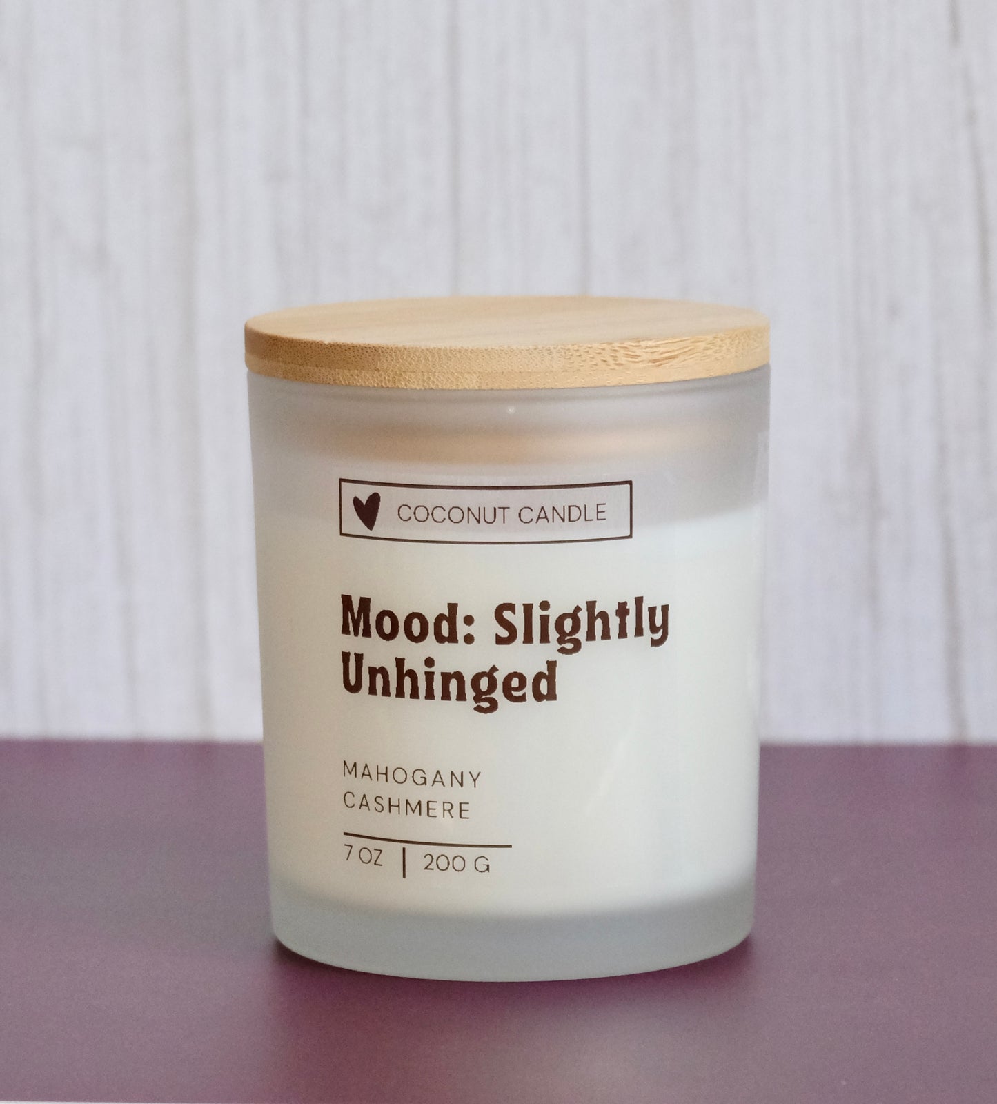 Customizable frosted glass candle with the words Mood: Slightly Unhinged