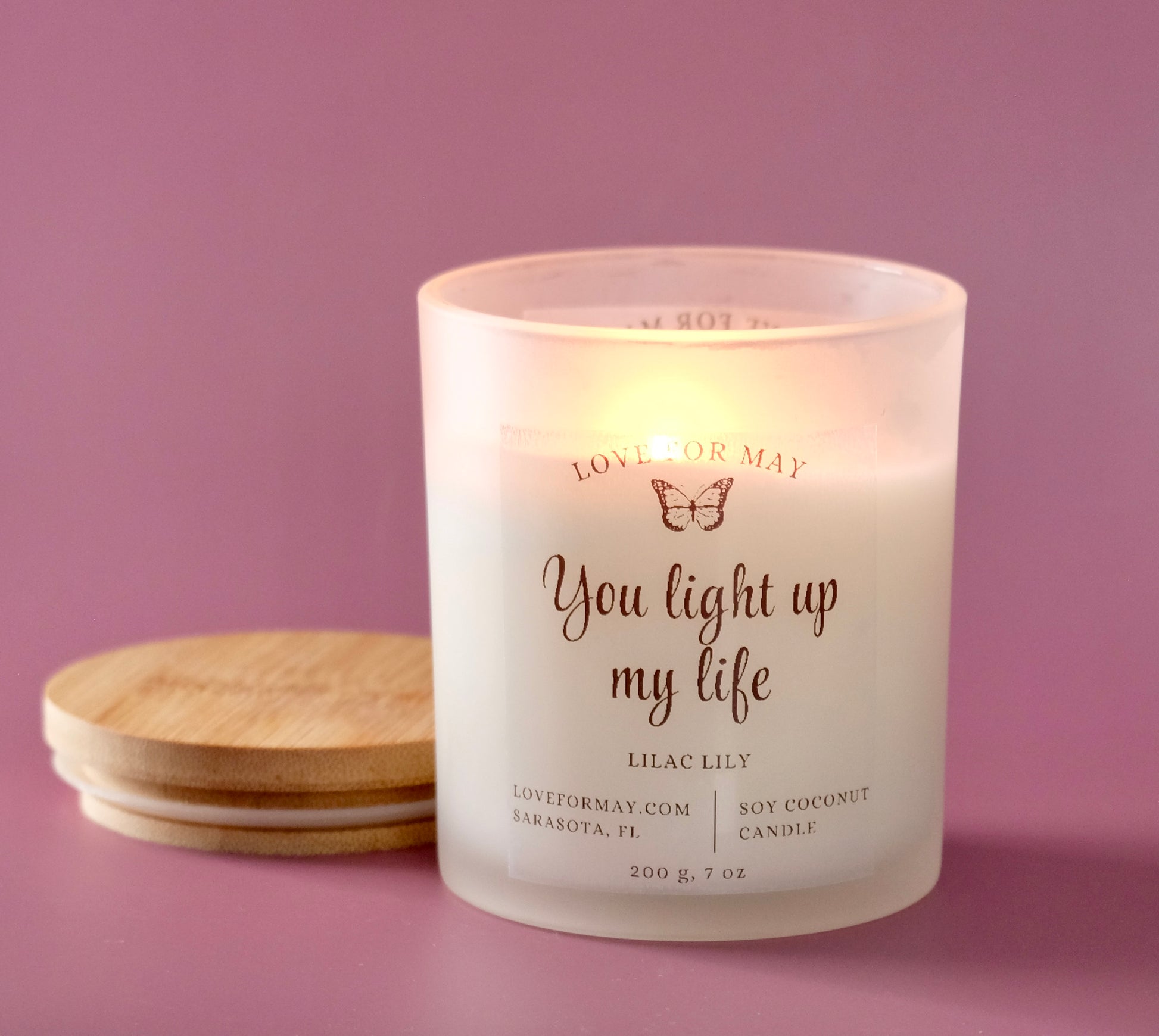 Handmade frosted glass personalized candle with the words You light up my life.