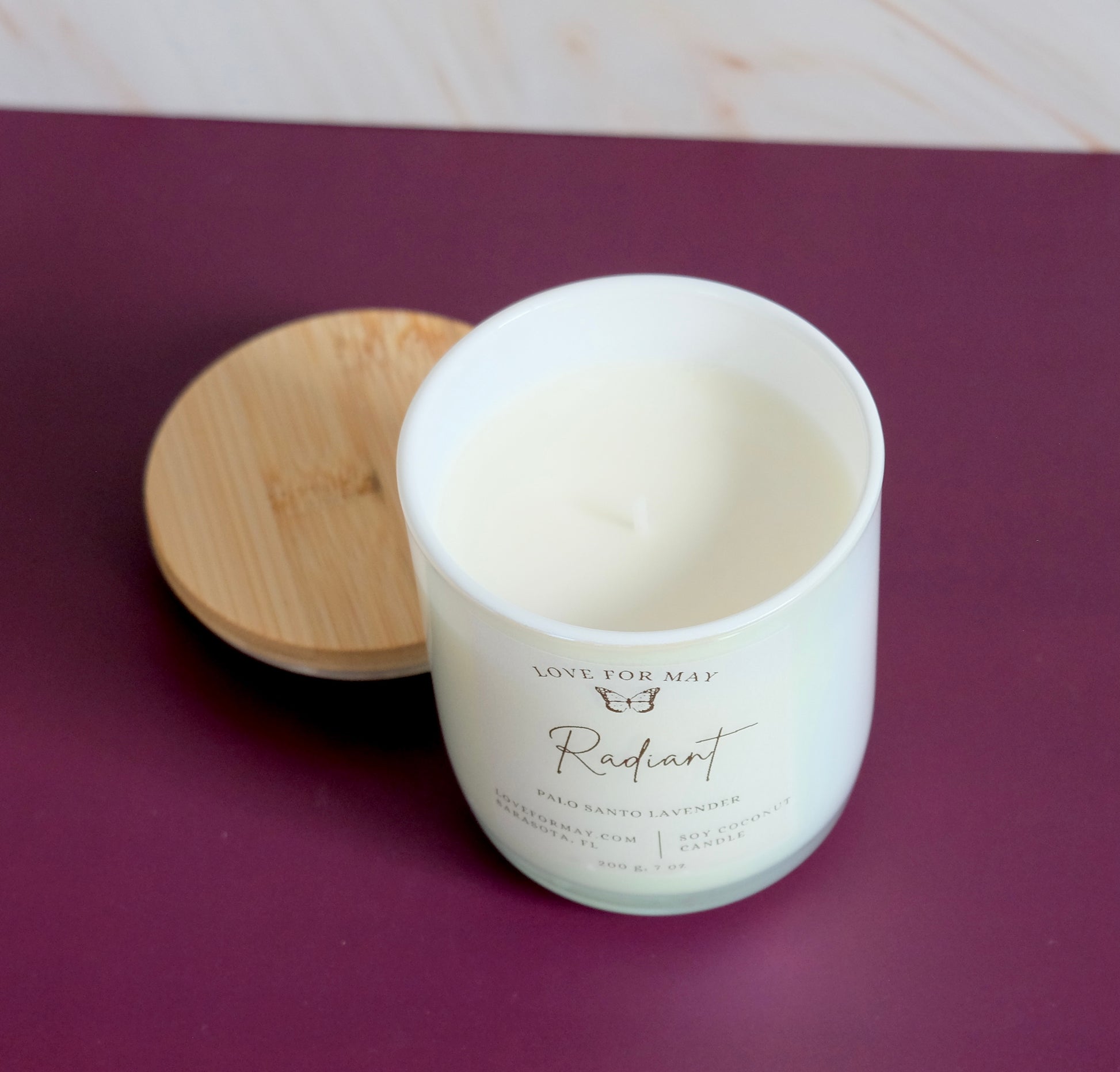 Handmade iridescent manifestation candle labeled Radiant by 'Love for May' 