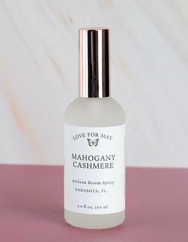 Room spray scented mahogany cashmere in a frosted glass bottle with rose gold lid.